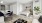 a room with a bed and chairs